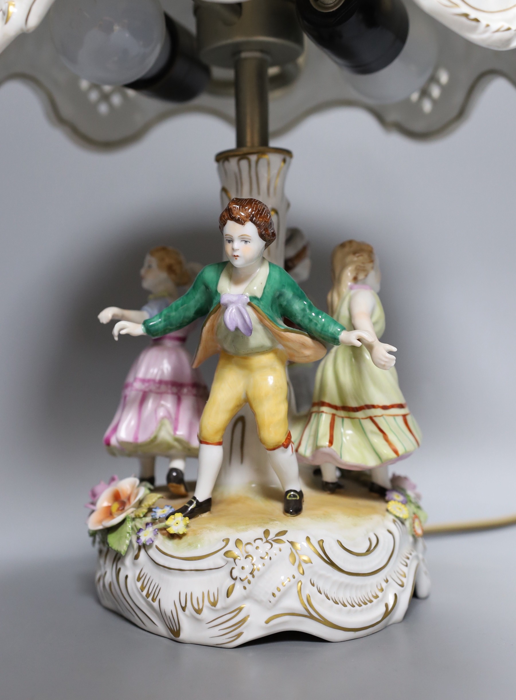 A German porcelain figural lamp with lithophane shade, 40cm